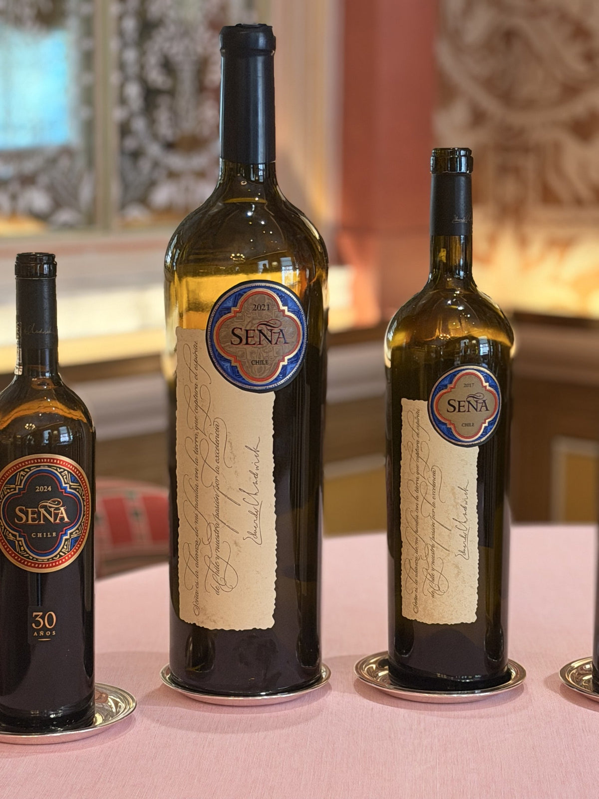 Seña 2024, 2021 and 2017 on the table at the lunch in London, September 2026